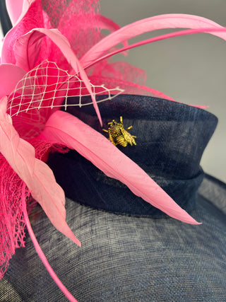 NAVY BLUE FLIPPED BRIM HAT WITH PINK FLORAL BLOOM