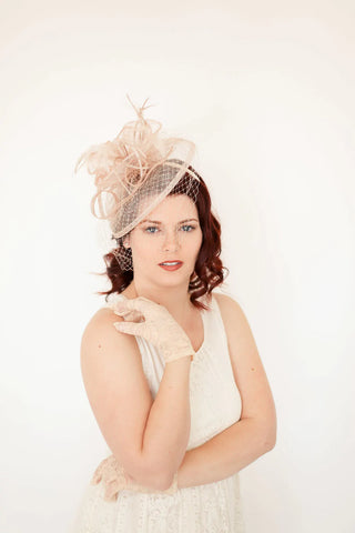 NUDE fascinator with feathers on headband, ideal for weddings, races, and special occasions