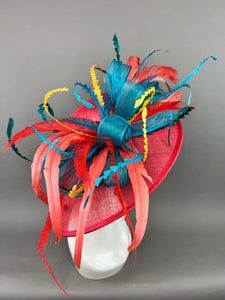 RED WIDE BRIM WITH TEAL BOW AND FEATHERS.