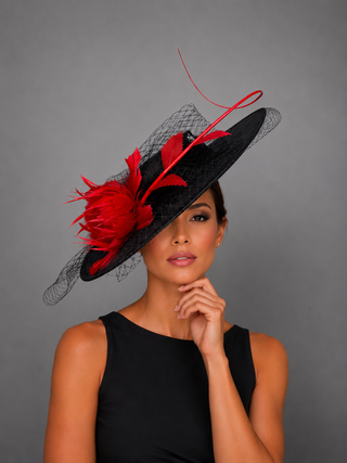 BLACK BOATER HAT WITH RED FEATHER ROSE.