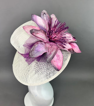 PURPLE FLORAL BLOOM ON LIGHT IVORY BASE.