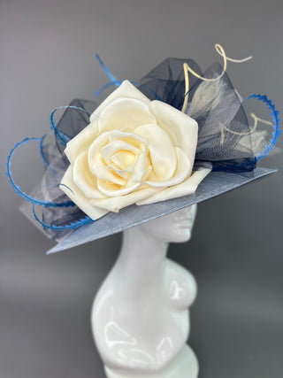 LIGHT BLUE OVAL DERBY HAT WITH CREAM FLORAL BLOOM