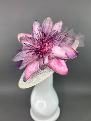 PURPLE FLORAL BLOOM ON LIGHT IVORY BASE.