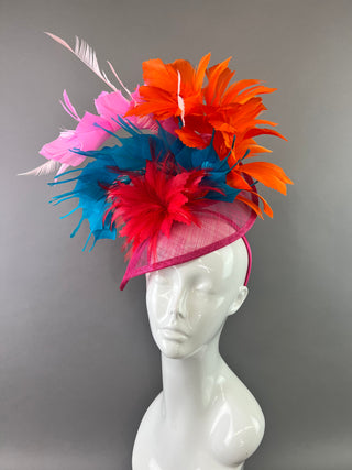 FUCHSIA FASCINATOR WITH MULTI COLOR FEATHER SPRAYS