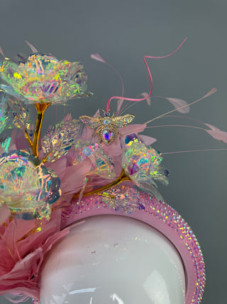 LIGHT PINK HEADBAND FASCINATOR WITH IRIDESCENT ROSES.
