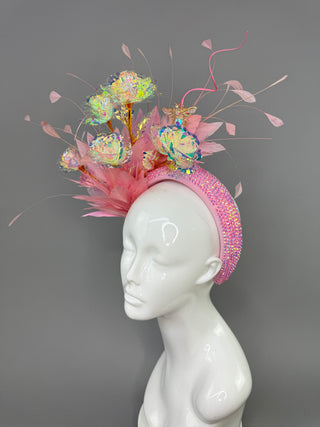 LIGHT PINK HEADBAND FASCINATOR WITH IRIDESCENT ROSES.