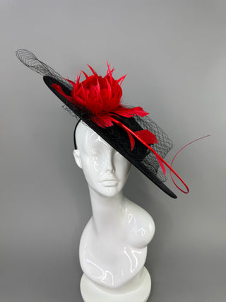 BLACK BOATER HAT WITH RED FEATHER ROSE.