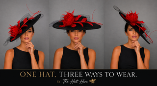 BLACK BOATER HAT WITH RED FEATHER ROSE.