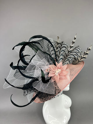 BLUSH PINK HAT WITH BLACK AND WHITE ACCENTS.
