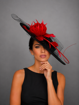 BLACK BOATER HAT WITH RED FEATHER ROSE.