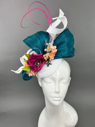 Handcrafted white silk abaca fascinator with teal ribbon and deep magenta flowers, perfect for the Kentucky Derby or a wedding.
