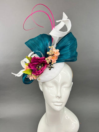 Handcrafted white silk abaca fascinator with teal ribbon and deep magenta flowers, perfect for the Kentucky Derby or a wedding.