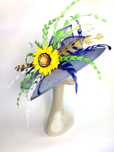 Light blue, faded denim sinamay hat base adorned with royal blue, white and green hand trimmed feathers perfect for the Kentucky Derby, Church, Wedding, Bridal Shower, Wedding or any special occasion 