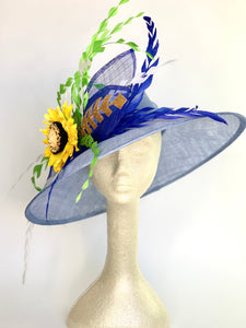 Light blue, faded denim sinamay hat base adorned with royal blue, white and green hand trimmed feathers perfect for the Kentucky Derby, Church, Wedding, Bridal Shower, Wedding or any special occasion 